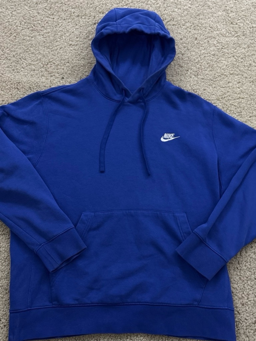 Nike Blue Hoodie with Small White Swoosh (It runs small, so it’s like Size L)